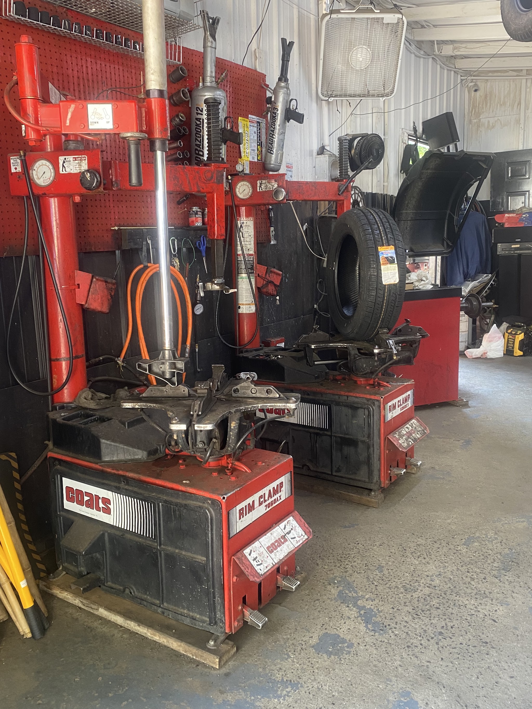 Our two Coats tire changers, with a tire ready to mount